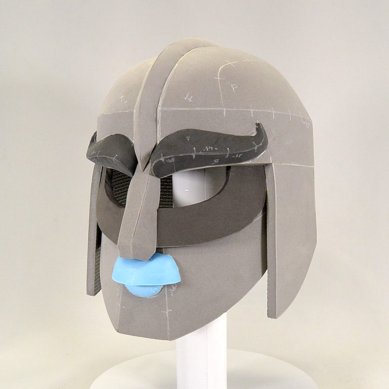 Celtic inspired historical helmet made with grey EVA foam, human like attribues thanks to eyebrows, nose and lips - cosplay headgear made with EVA foam