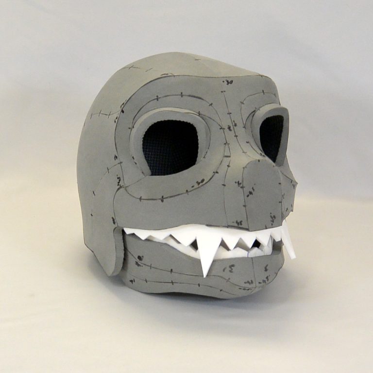 Scary animal-like head helmet with black, large eyesockets and pointy teeth. Made using EVA foam - cosplay headgear, perfect for Halloween