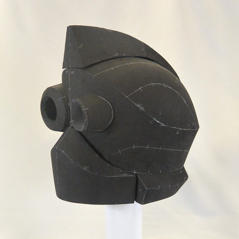 SiFi inspired robot like helmet with two different size of eye sockets and mohawk, made using black EVA foam - cosplay headgear