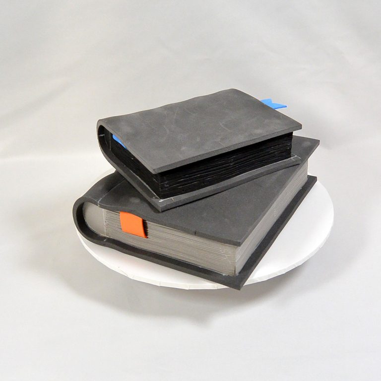 Two books in different sizes made with various EVA foam props - cosplay items