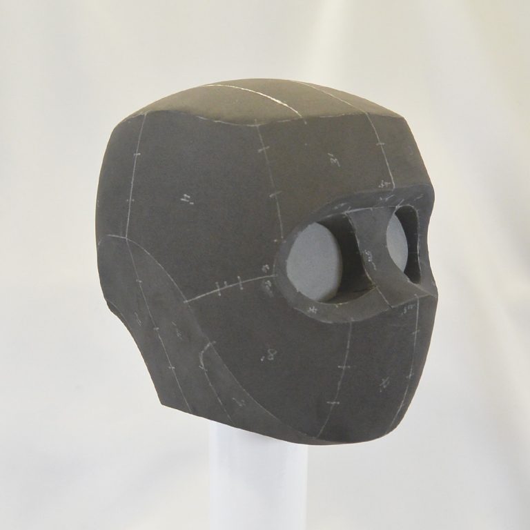 Futuristic robot helmet with large round eyes and dynamic lines. Minimalistic design made using grey EVA foam - cosplay item