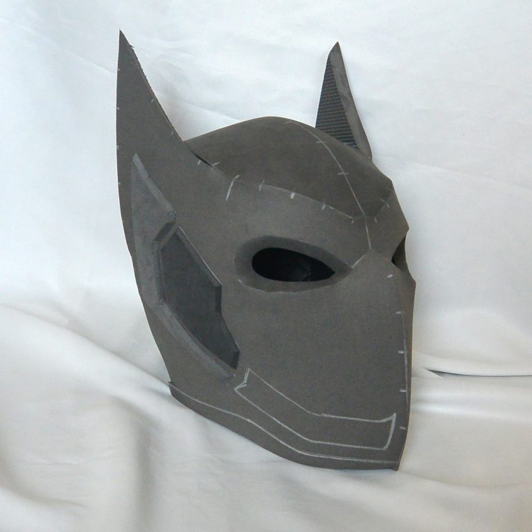 Futuristic superhero helmet with pointy hears and slick, dynamic design. Made with grey EVA foam - cosplay headgear